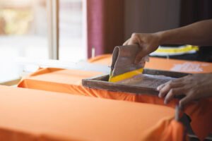 Silkscreen t-shirt printing process in Malaysia showing vibrant ink applied on fabric