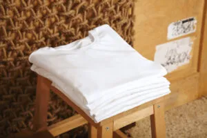 Close-up picture of cotton fabric and plain cotton t-shirt